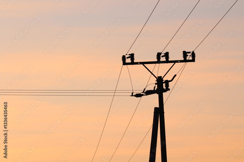 Electrical pole with electrical cables on a beautiful gold sky background
Electrical pole with electrical cables on a beautiful gold sky background
