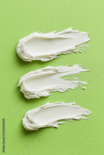 Layers of creamy texture artfully sprawled across a vibrant green background in an abstract culinary delight