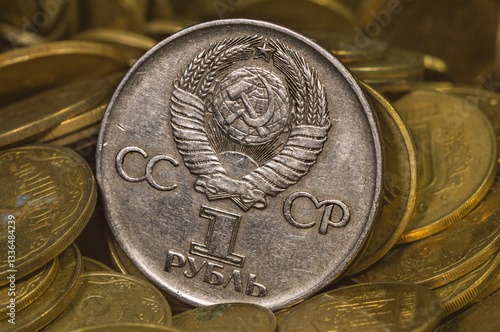old silver coin on brass coins background