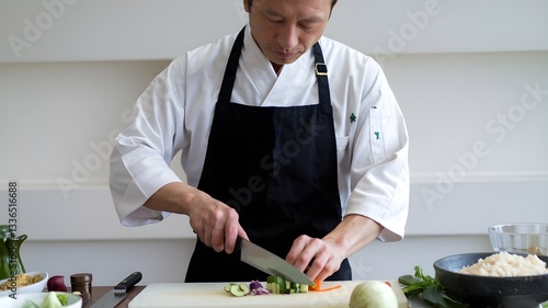  Japanese Chef Cooking in Kitchen with Expertise - Isolated on White Background, Authentic Culinary Action