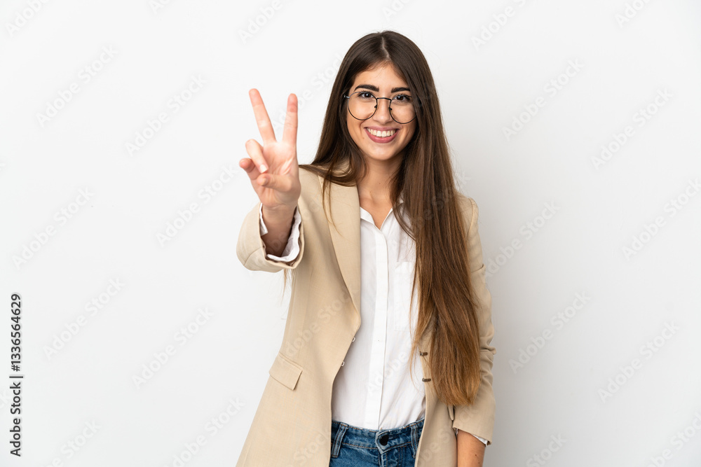 Young caucasian woman isolated on white background smiling and showing victory sign Young caucasian woman isolated on white background smiling and showing victory sign