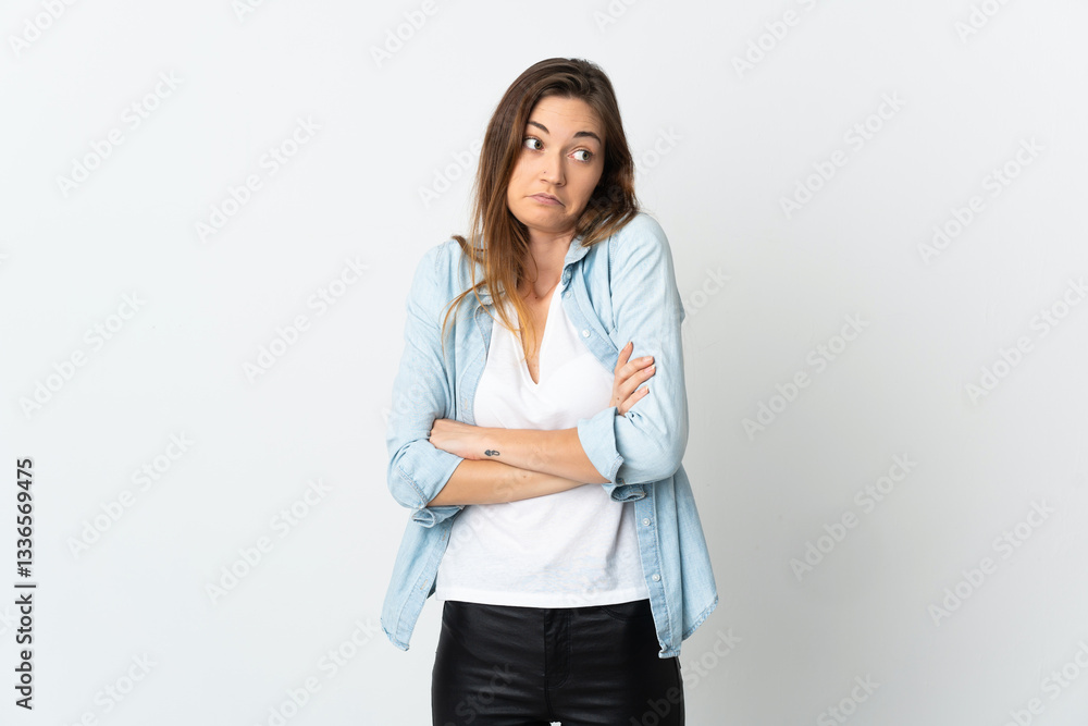 Young Ireland woman isolated on white background making doubts gesture while lifting the shoulders Young Ireland woman isolated on white background making doubts gesture while lifting the shoulders
