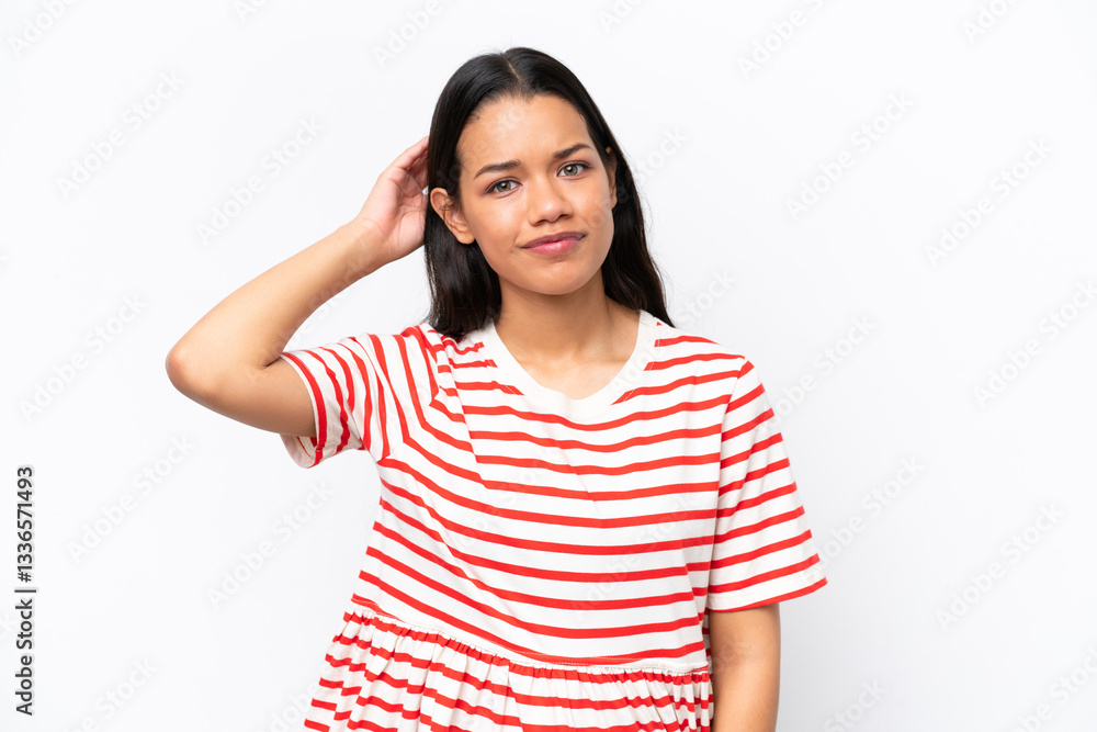 Young Colombian woman isolated on white background having doubts Young Colombian woman isolated on white background having doubts
