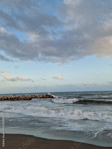 Tranquil Coastal Waves Against Rocky Shore