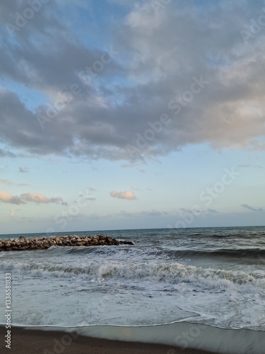 Tranquil Coastal Waves Against Rocky Shore
