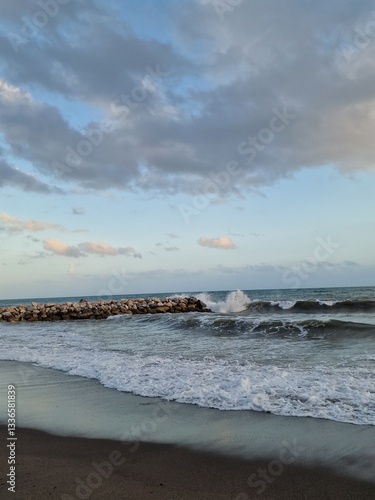 Tranquil Coastal Waves Against Rocky Shore