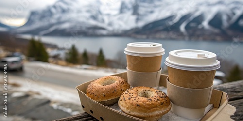 Cupholder with paper coffee cups and bagels on the mountain view