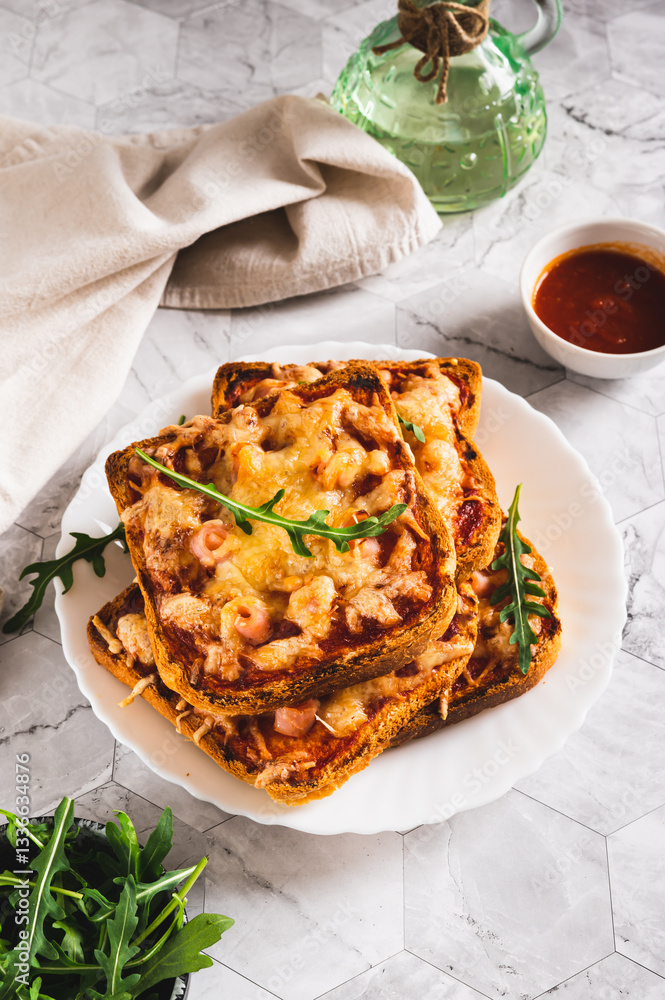 Crispy pizza with bacon, cheese and ketchup on toast on a plate on the table vertical view