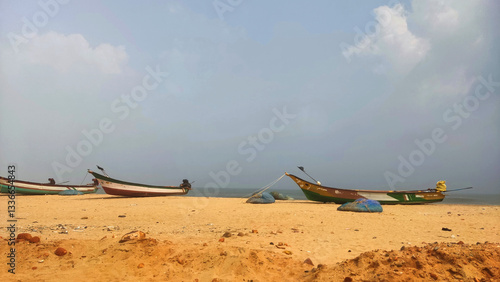 Fotografie boats on the shore of Pazhaverkady beach, Tamil Nadu, India