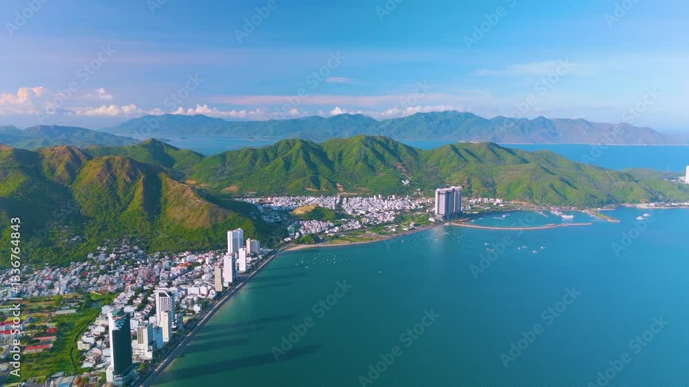 Beach overlooking Bai Tam Hon Chong aerial top view city on the gold main resort coast of Southeast Asia in sunny evening Nha Trang arounds hills and mountains Beach overlooking Bai Tam Hon Chong aerial top view city on the gold main resort coast of Southeast Asia in sunny evening Nha Trang arounds hills and mountains