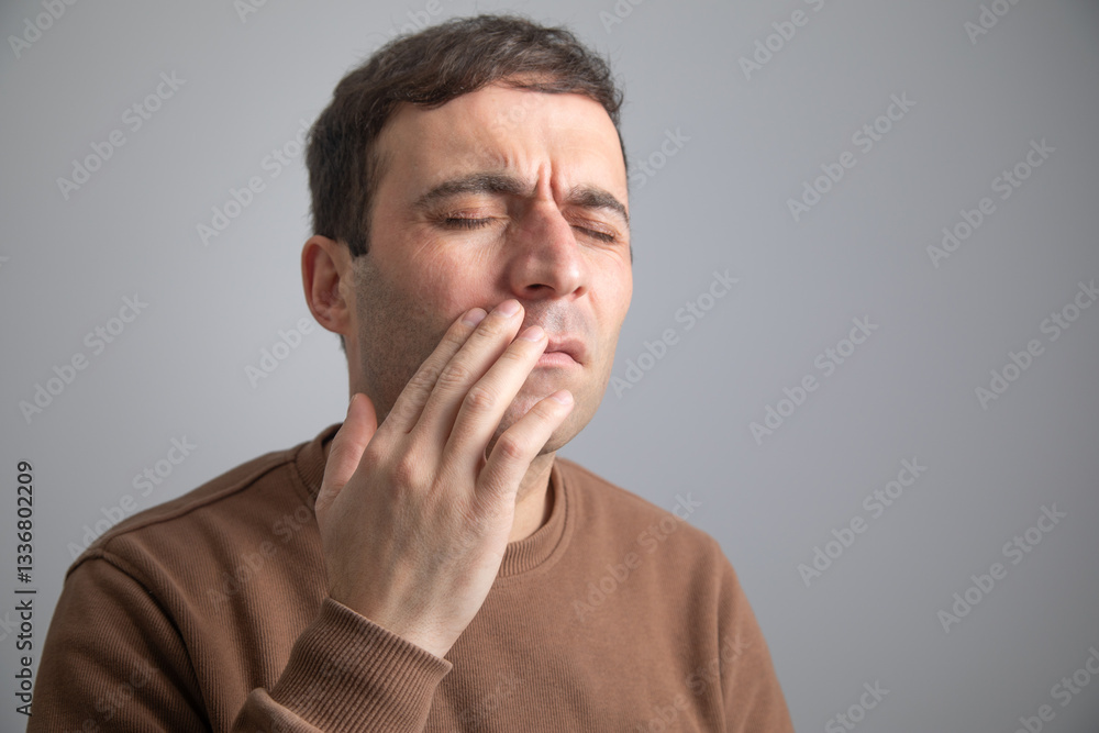 Caucasian man suffering from tooth pain. Caucasian man suffering from tooth pain.