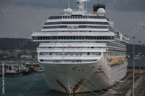 Family cruiseship or cruise ship liner Favolosa in Civitavecchia Rome, Italy port on grey windy day grey sky during Mediterranean autumn winter cruising dream vacation