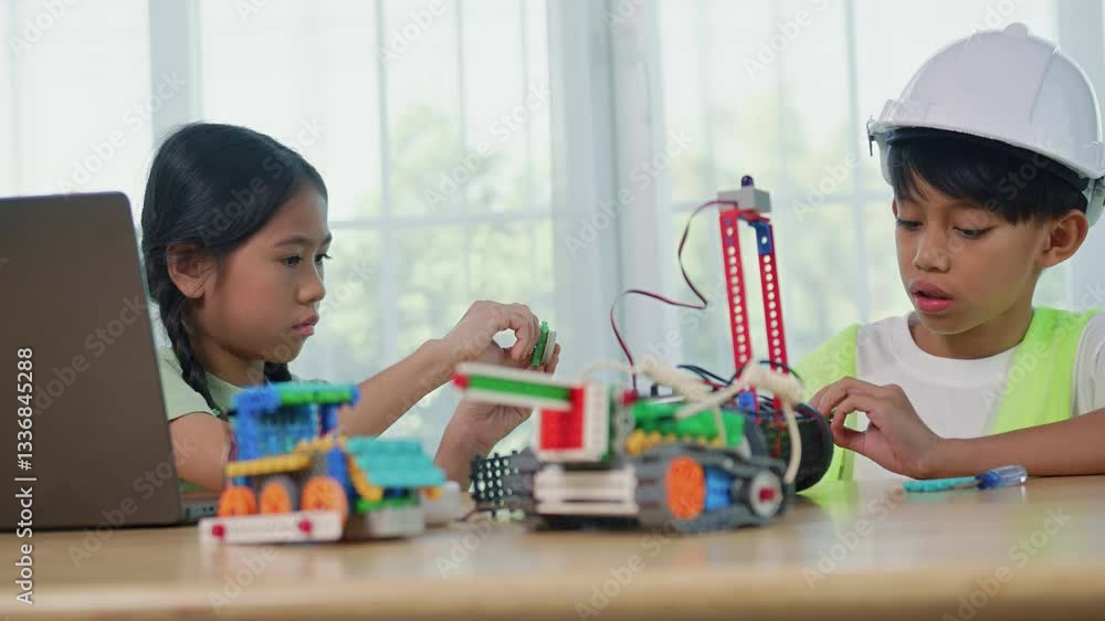 Kids playing with construction blocks on table, child playing and building with colorful plastic bricks. Early learning and development. Kids playing with construction blocks on table, child playing and building with colorful plastic bricks. Early learning and development.