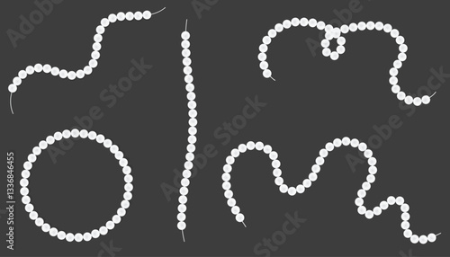 Various arrangements of pearl necklaces. Set of white pearl beads on different shape strings. Mother-of-pearl necklace collection on black velvet background.