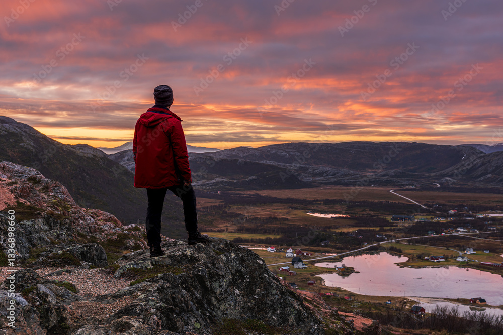 Fototapeta premium Traveller enjoying sunrise in Norway