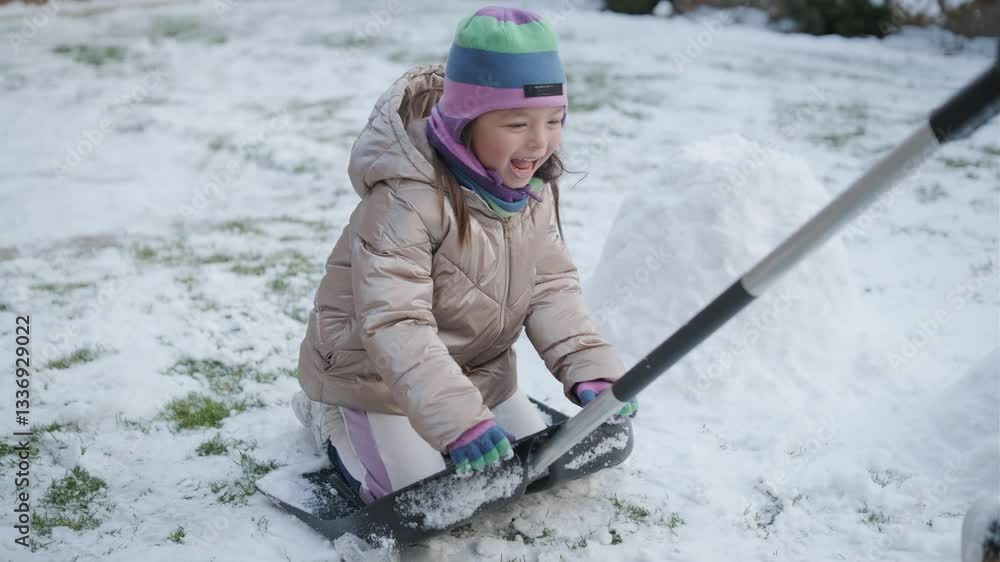 Girl and her grandfather having fun in the snowy backyard Girl and her grandfather having fun in the snowy backyard