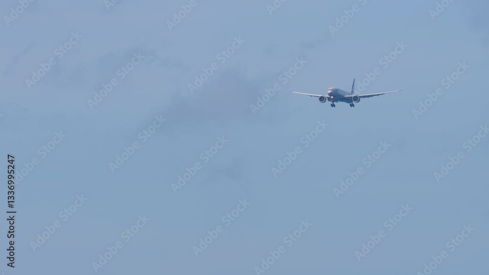 Jet plane approaching landing. Aircraft with unrecognizable livery descending, arriving. Aircraft in the blue sky Jet plane approaching landing. Aircraft with unrecognizable livery descending, arriving. Aircraft in the blue sky