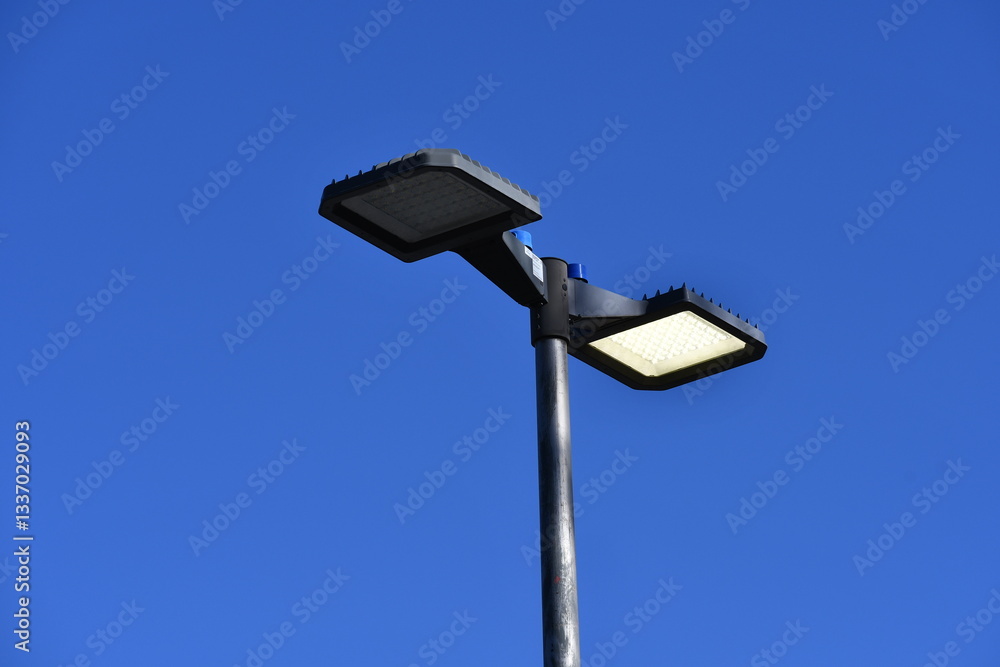 Light pole in parking lot. One light burnt out. LED Light pole in parking lot. One light burnt out. LED