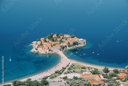 Yachts are moored off the coast of the island of Sveti Stefan. Montenegro. Drone