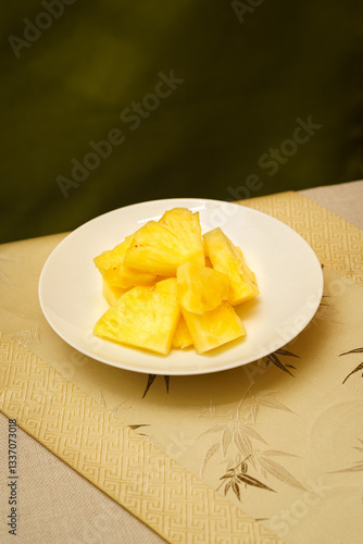 Cut pineapple on a simple background