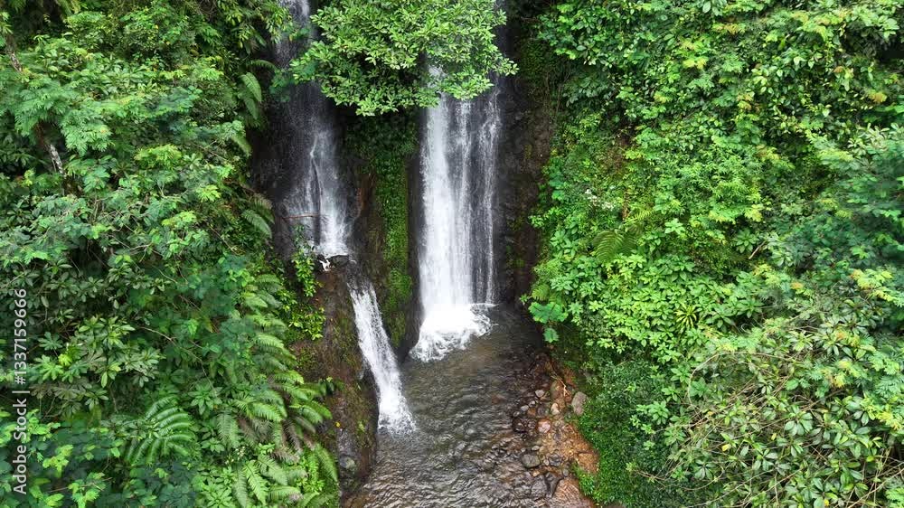 Cilember Waterfall, West Java, Indonesia: A serene South Asian spot for chilling and enjoying nature, captured from a drone. Cilember Waterfall, West Java, Indonesia: A serene South Asian spot for chilling and enjoying nature, captured from a drone.