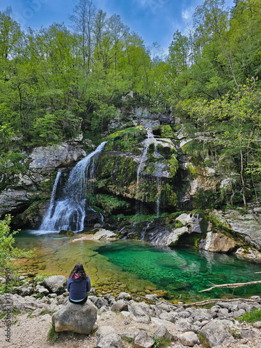 Tableau sur toile Female traveler admiring cascading waters of slap virje waterfall, surrounded by