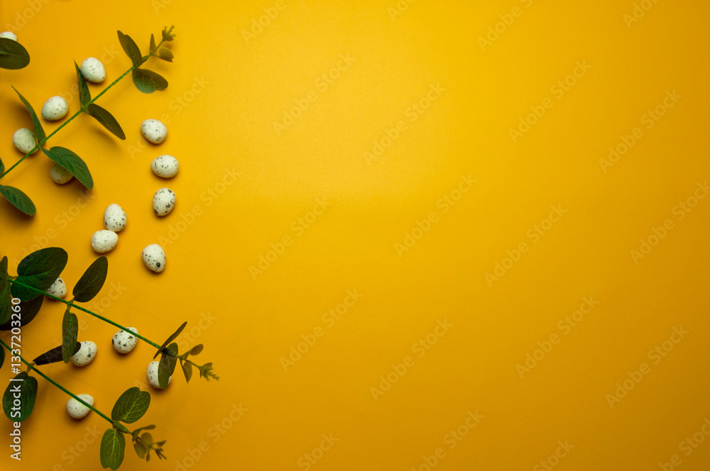 Fototapeta premium Easter eggs on yellow background.Happy Easter concept. Preparation for holiday.Simple minimalism, flat lay, top view, copy space.
