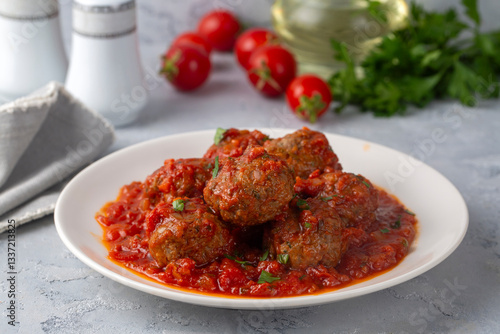 Obraz na płótnie Delicious fresh meatballs in tomato sauce with salt, spices and herbs w salonie