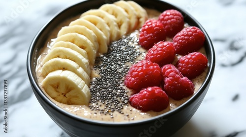 A bowl of overnight oats topped with fresh fruit, chia seeds, and almond butter, styled with a clean