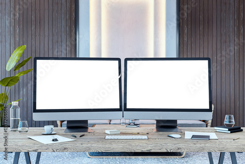 Фотография Dual desktop computer screens with blank mockups on a wooden desk in a modern office interior