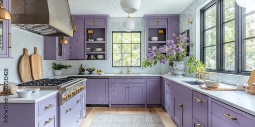 A modern kitchen design with purple cabinets and marble counters