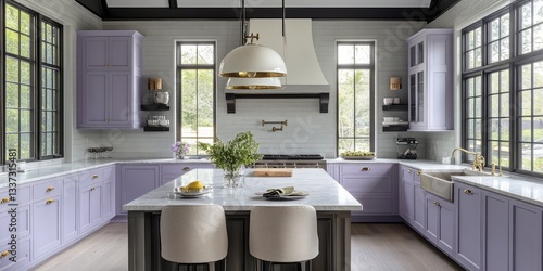 A well designed modern kitchen with lavender colored cabinets and island