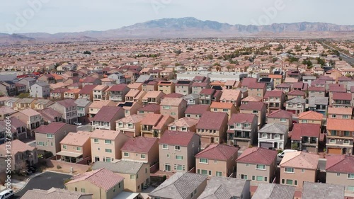 Aerial drone shot of Las Vegas suburban residence homes mountains casion 02