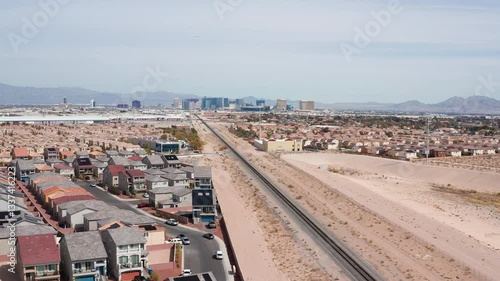 Aerial drone shot of Las Vegas suburban residence homes mountains casion 08
