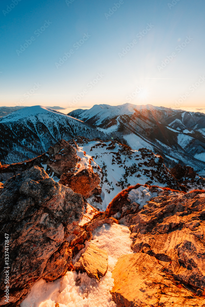 Obraz premium Winter hiking to Velky Rozsutec in Mala Fatra National park is full of beautiful views. Sunset in Slovakia mountains. Slovakia landscape