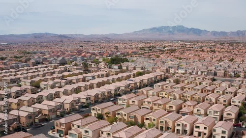 Aerial drone shot of Las Vegas suburban residence homes mountains casino 09