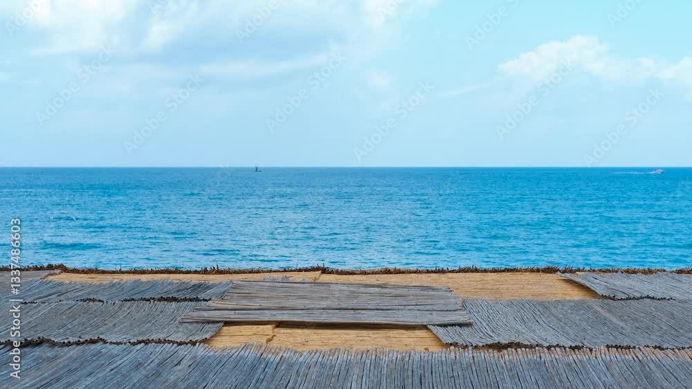 Tranquil sea view with wooden roof and calm horizon. Watching the peaceful ocean view with sunlit wooden roof, with gentle waves and vast horizon under bright sky. Tranquil sea view with wooden roof and calm horizon. Watching the peaceful ocean view with sunlit wooden roof, with gentle waves and vast horizon under bright sky.