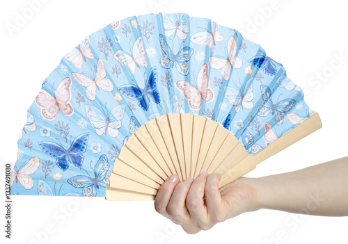 Hand holding fan with floral pattern on white background isolation