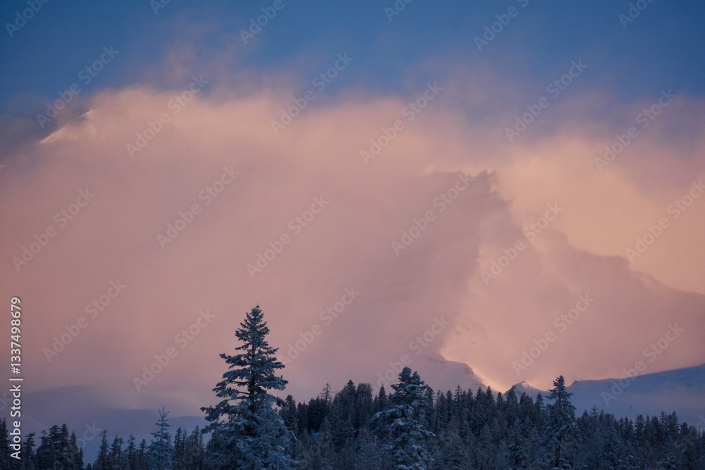 Fototapeta premium Snowy mountain peak in twilight