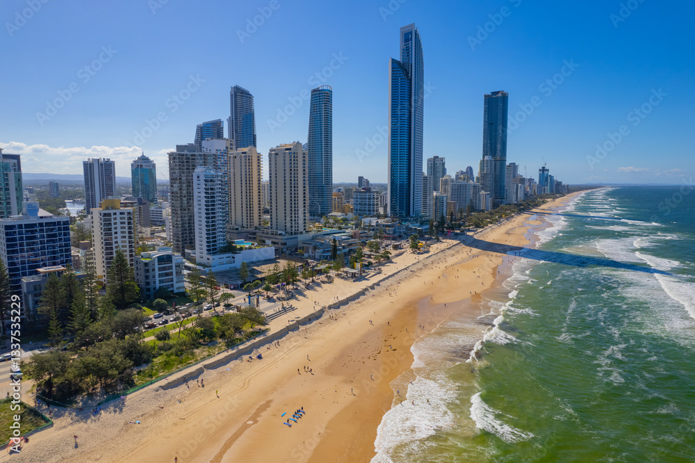 Tourists return to Surfers Paradise after the beach suffered storm damage and sand erosion caused by Cyclone Alfred Tourists return to Surfers Paradise after the beach suffered storm damage and sand erosion caused by Cyclone Alfred