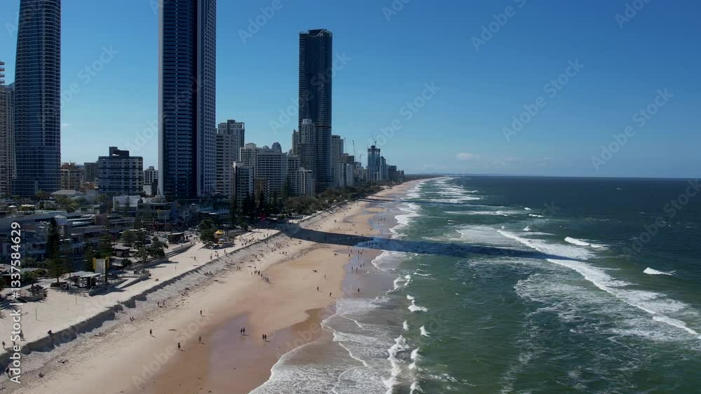 Tourists return to Surfers Paradise after the beach suffered storm damage and sand erosion caused by Cyclone Alfred Tourists return to Surfers Paradise after the beach suffered storm damage and sand erosion caused by Cyclone Alfred