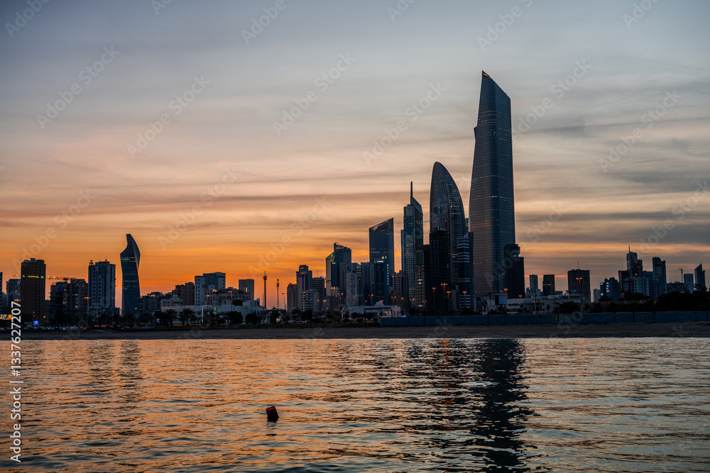 Fototapeta premium Kuwait City Skyline at Sunset with Reflections on the Arabian Gulf