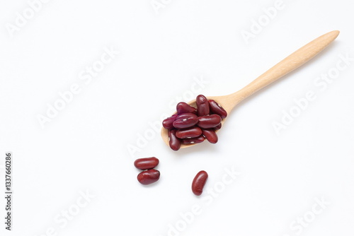 Red kidney beans in spoon isolated on white background 