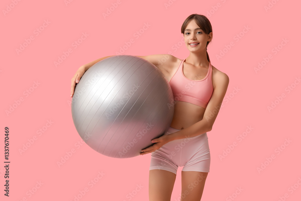 Young woman with fitball on pink background Young woman with fitball on pink background