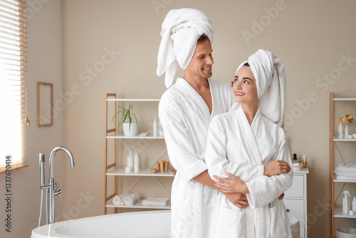 Young couple with towels hu...