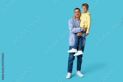 Happy father holding his li...