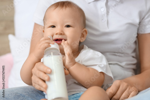 Cute little baby with mothe...