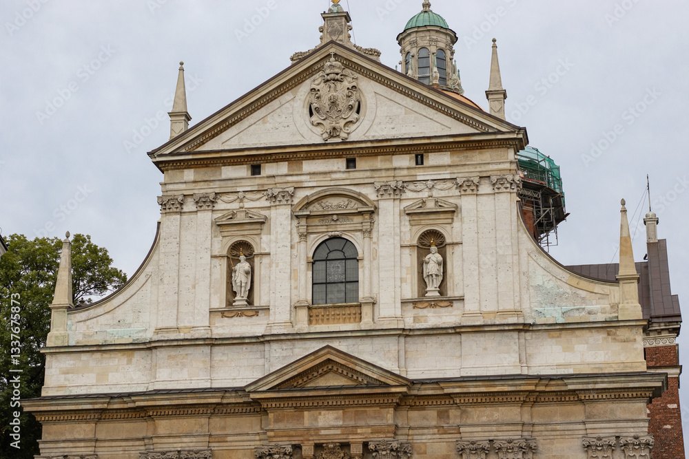 Fototapeta premium Baroque Church Facade with Sculptures, Ornate Decorations, and a Historic Dome in a European City
