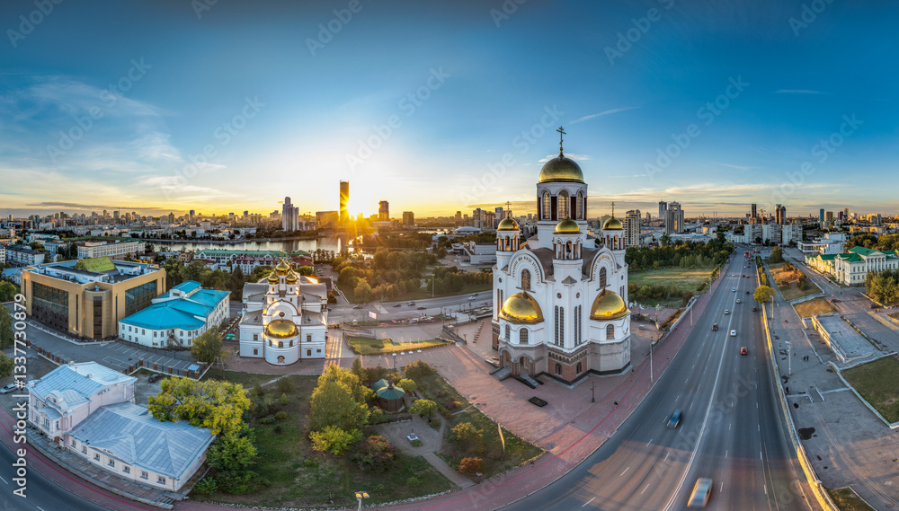 Fototapeta premium Summer Yekaterinburg, Temple on Blood and Church of St Nicholas in sunset. Aerial view of Yekaterinburg, Russia. Translation of text on the temple: Honest to the Lord is the death of His saints