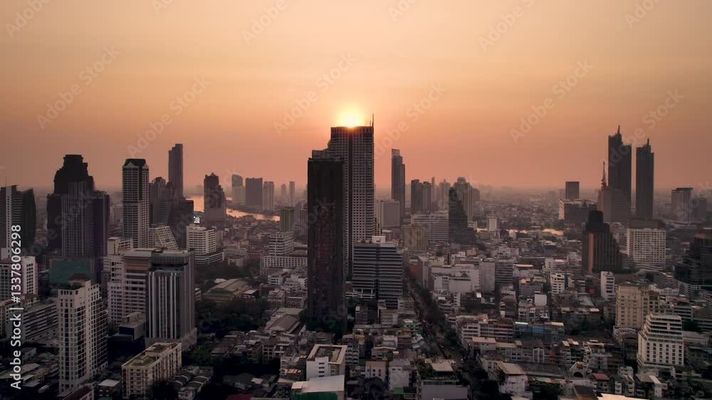 Sunset at Bangkok high aerial view of the Chao Phraya River at Si Lom districts at sunset. A large asian capital city with skyscrapers and millions of inhabitants. Beautiful Cinematic 4k footage 2025 Sunset at Bangkok high aerial view of the Chao Phraya River at Si Lom districts at sunset. A large asian capital city with skyscrapers and millions of inhabitants. Beautiful Cinematic 4k footage 2025